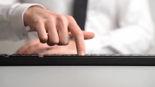 Businessman Pressing A Button On Computer Keyboard