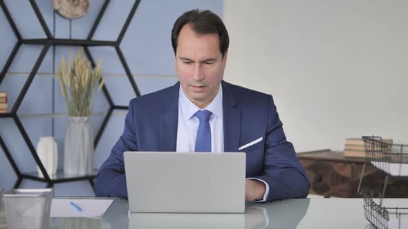 Businessman in Shock By Loss Wondering in Awe alt