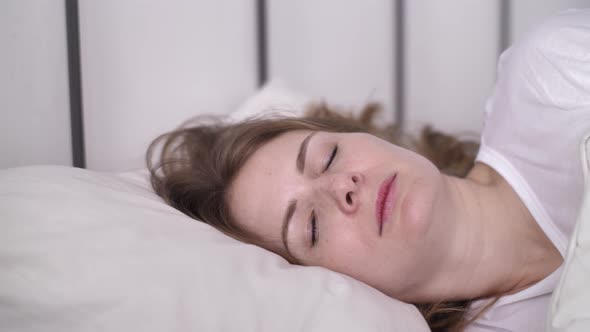 Insomnia, Irritated Female Trying to Sleep Annoyed by Bad Noisy Neighbors alt