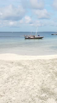 Vertical Video Boats in the Ocean Near the Coast of Zanzibar Tanzania alt