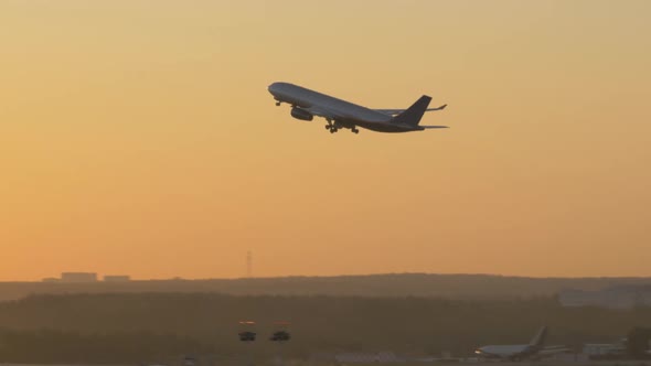 Evening Airplane Takeoff alt