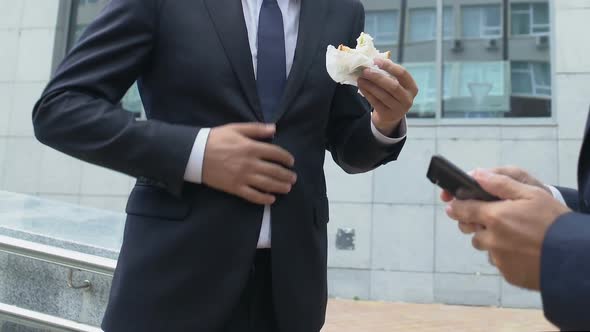 Businessman Having Unhealthy Lunch Snack and Suffering Abdominal Pain at Work