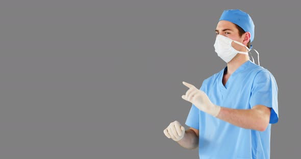 Surgeon pretending to be using futuristic digital screen alt