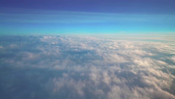 Airplane Flying Above The Clouds alt