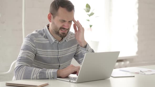 Distraught Adult Man with Headache at Work alt