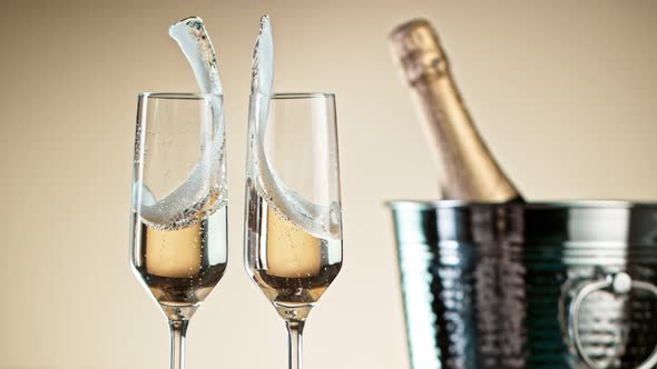Super Slow Motion Shot of Clinking Two Glasses of Champagne at 1000Fps. alt