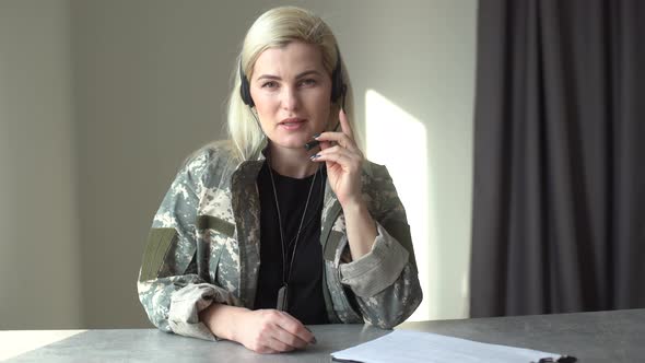 Happy Soldier Woman Smiling While Making Conference Call on Laptop Indoors