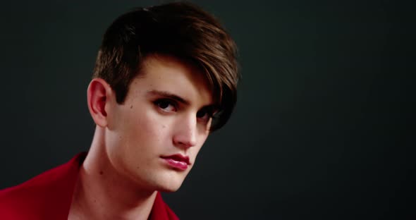 Androgynous man wrapped in red clothes alt