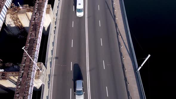 Traffic road dam. Aerial view of motorway road and cycling path on polder dam, car traffic above