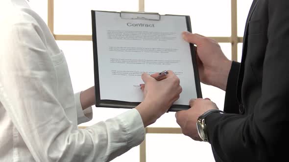 Businesslady Signing a Contract and Taking Keys alt