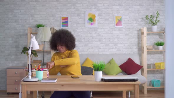 Portrait Beautiful African American Woman with an Afro Hairstyle Unexpected Attack or Heart Pain alt