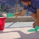 A Young Man is Washing a Carpet on a Balcony Using Foam - VideoHive Item for Sale