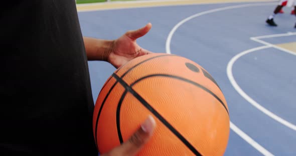 Basketball player playing with basketball 4k alt