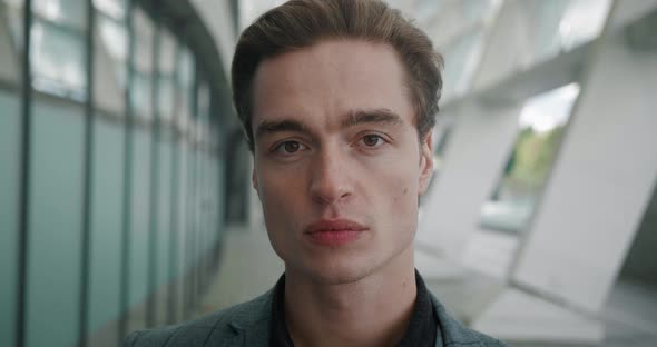 Close Up Portrait Confident Man in Stylish Suit Looking at Camera alt