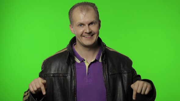 Man Rocker Asking To Subscribe, Trying To Control, Pointing Fingers Down. Chroma Key Background alt