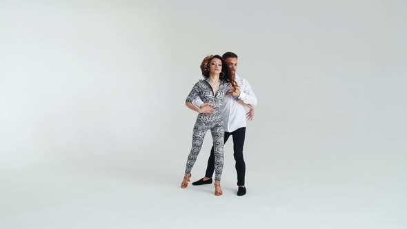 Concept of Love, Relationships and Social Dancing. Young Beautiful Couple Dancing Sensual Dance on a alt