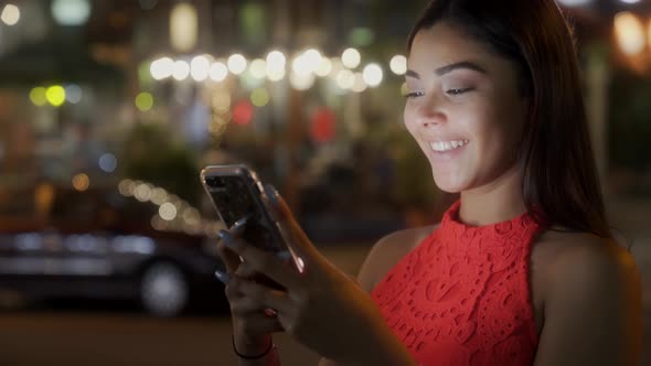 A young beautiful hispanic latina woman using smartphone 5g to send voice message