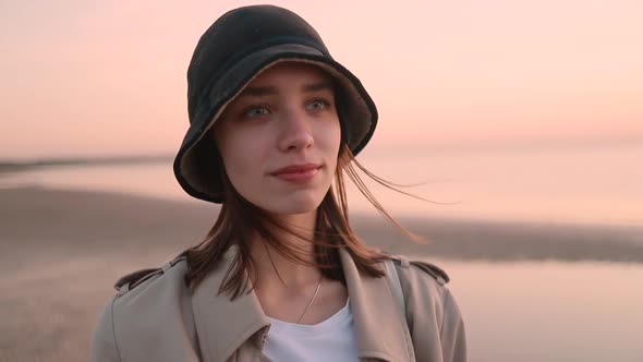 Woman in Hat Closeup on Background of Beach in Autumn Spbi alt