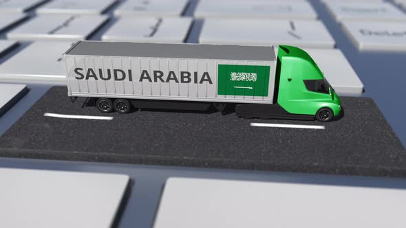 Flag of Saudi Arabia on Moving Truck and Computer Keyboard alt