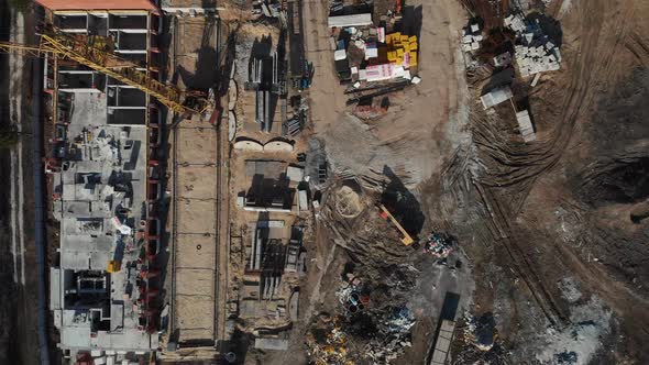 Drone Flying Over a Construction Site with a Top Down View. The Camera Flies Superstructure, Top alt