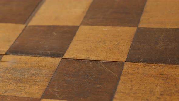 Slow tilt wooden chess set table rows and columns 4K 2160p 30fps UltraHD  footage - Tilting on ancie alt