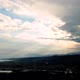Time lapse panorama of sun and rain above green valley and seashore - VideoHive Item for Sale