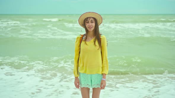 Camera Zooming to Closeup Portrait of Happy Young Ukrainian Woman in Hat Enjoying Sea Beach Getaway alt