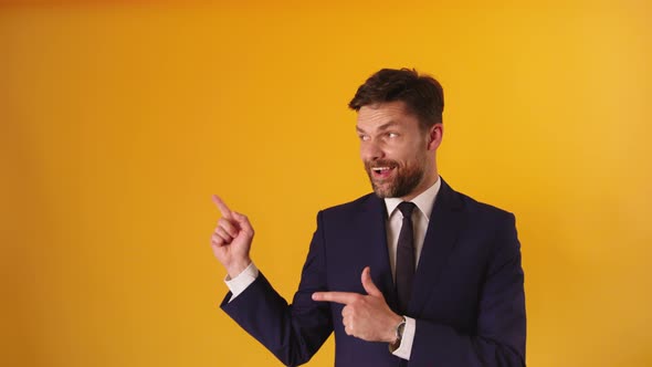 Portrait of Satisfied Handsome Guy in Formal Outfit Pointing on Empty Space  alt