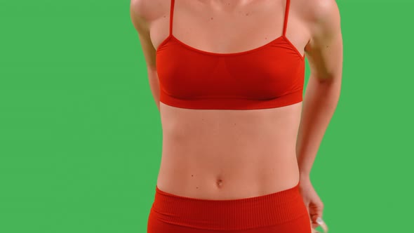 Green Screen Sporty Lady Holding Measurement Tape alt