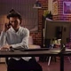 Asian Freelancer Chatting on Phone Call to Do Finance Work - VideoHive Item for Sale