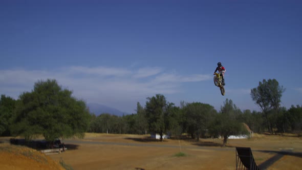 Motocross rider going off big jump, slow motion, 4K shot on RED Epic alt