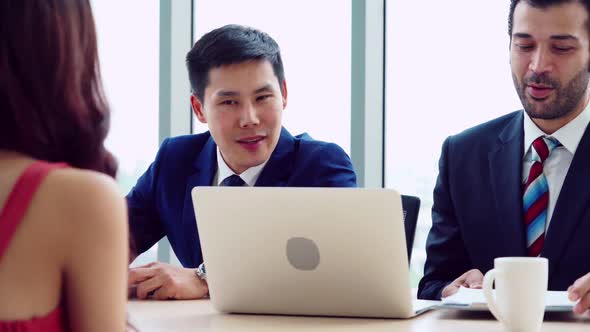 Smart Businessman and Businesswoman Talking Discussion in Group Meeting alt