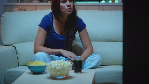 Enjoying the Evening Watching Tv Series at Home alt