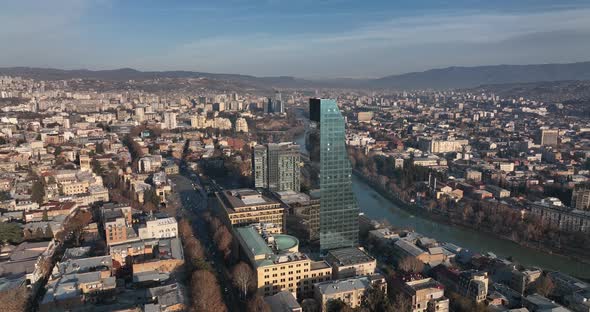 Flying over Shota Rustaveli street in the center of city. Morning aerial cityscape of Tbilisi alt