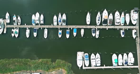 Aerial view panorama of wood platform for boat in the ocean little pier marina alt