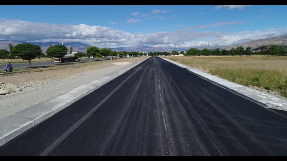 New Asphalt Road Near Green Field