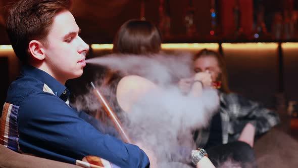 Authentic People Friends Party in Hookah Lounge Smoking Shisha Night Time alt
