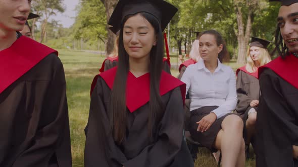 Caring Mom Encouraging Worried Female Graduate at Graduation Ceremony alt