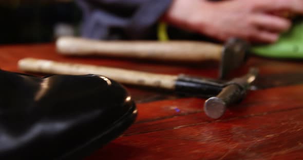 Shoemaker marking on shoe last with pen alt