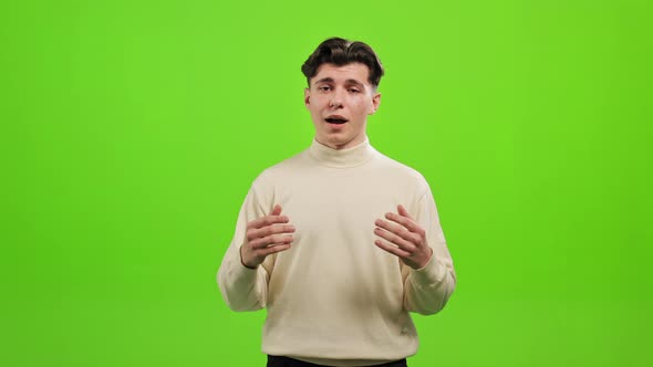 The Man is Standing and Looking at the Camera alt