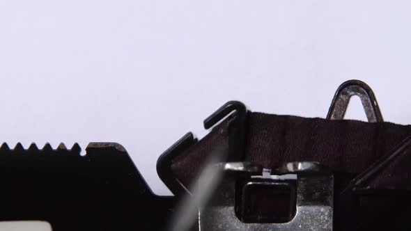 Applicant Prints a Resume on a Retro Typewriter. Close Up alt