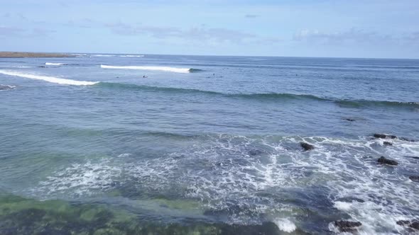 A View From Above of the Surfers in the Ocean