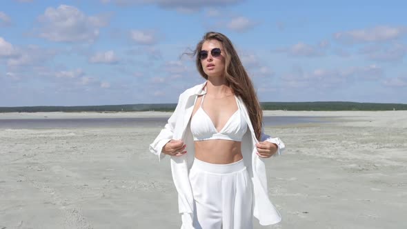 Beautiful Woman Walking on Shore