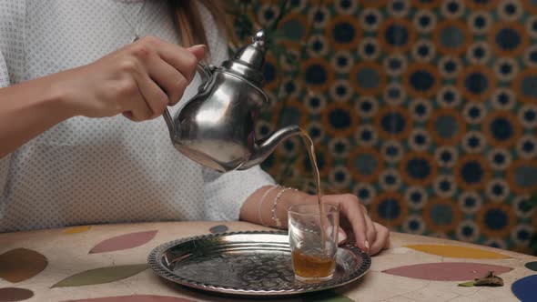 Close Up Macro Woman Hands Pouring Make Traditional Maroccan Tea, Metal Teapot alt