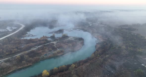 Autumn Morning Light Fog Aerial View of a Lake in Romania