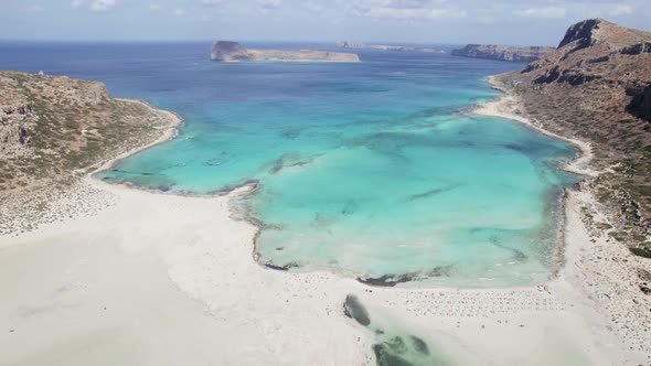 Aerial drone shot of beautiful white sand Balos beach with turquoise water. Sunny summer day. alt