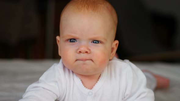 Little Baby Girl Holding Her Head and Exploring the World Around alt