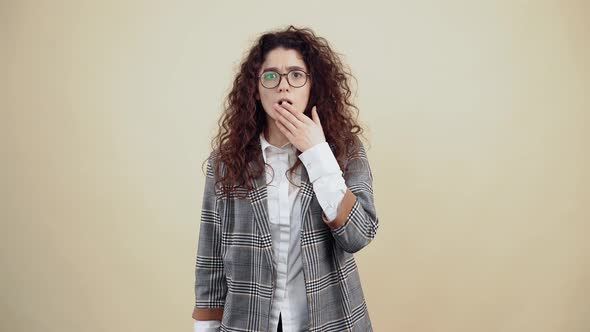 The Young Woman Surprised Shocked with Her Hand to Her Astonished Mouth Looks Into the Room Coming alt
