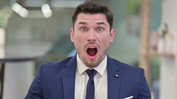 Disappointed Young Businessman Reacting to Loss Failure alt