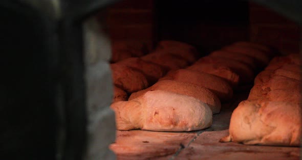 Cooking And Baking Breads Inside The Hot Oven. - close up shot alt